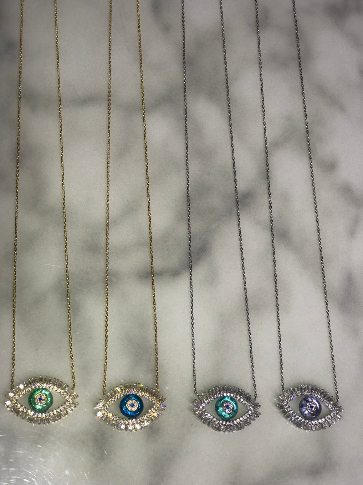 Eye baguette necklace with glass center