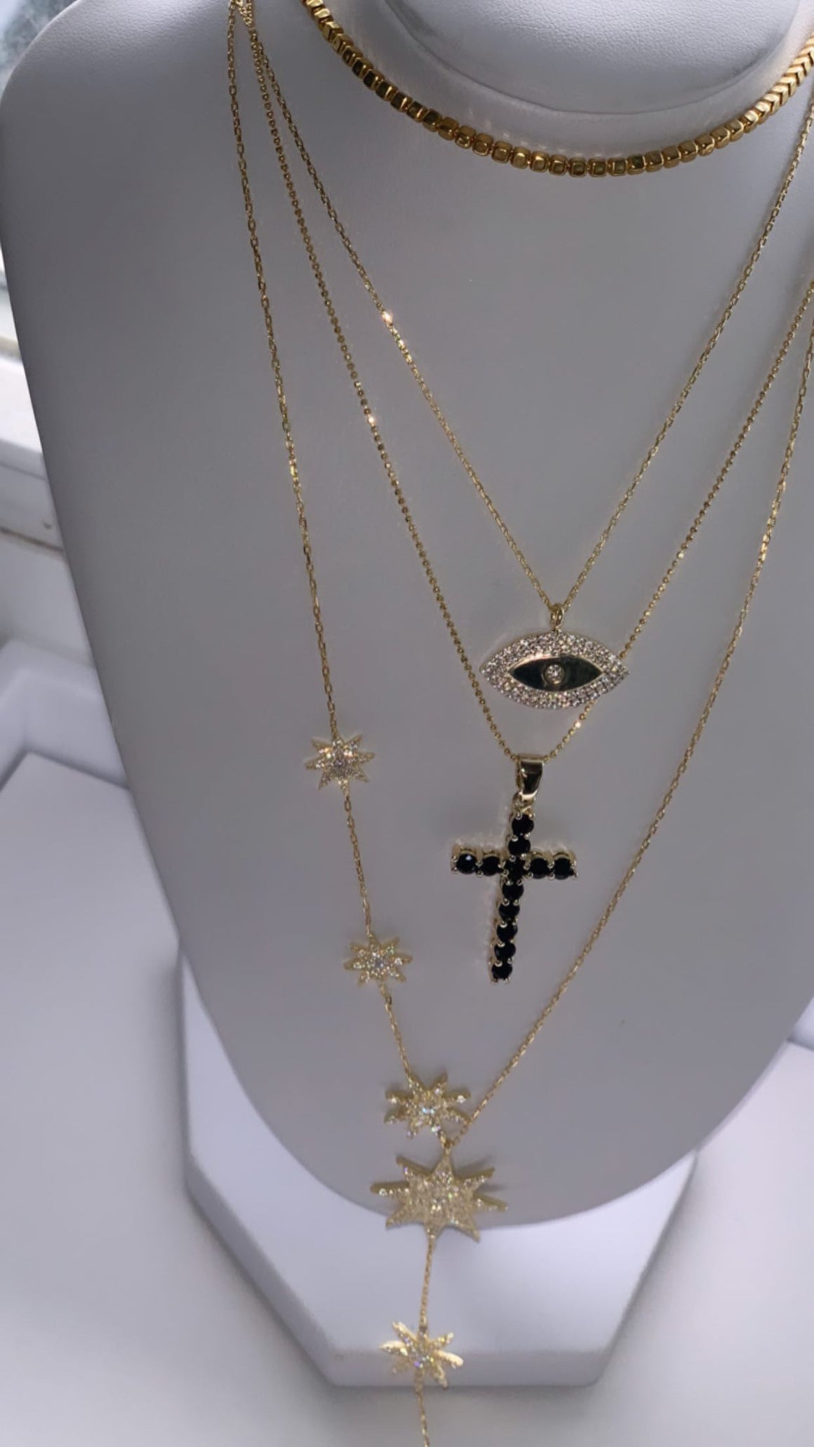 Gold plated black stone cross